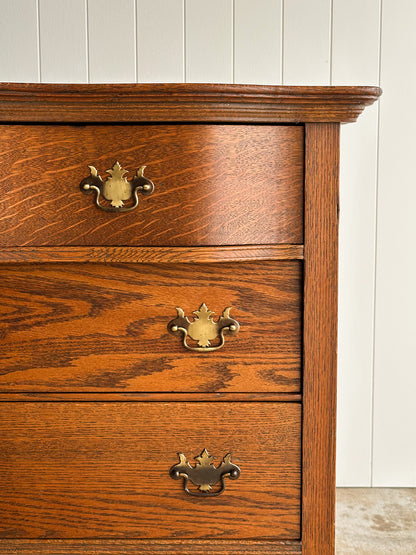 Antique Oak Serpentine Chest with Original Casters and Brass Hardware