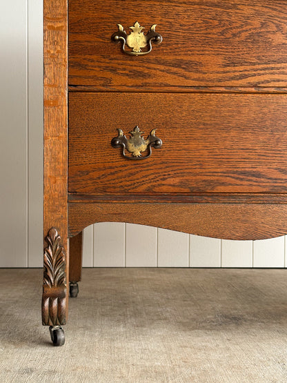 Antique Oak Serpentine Chest with Original Casters and Brass Hardware