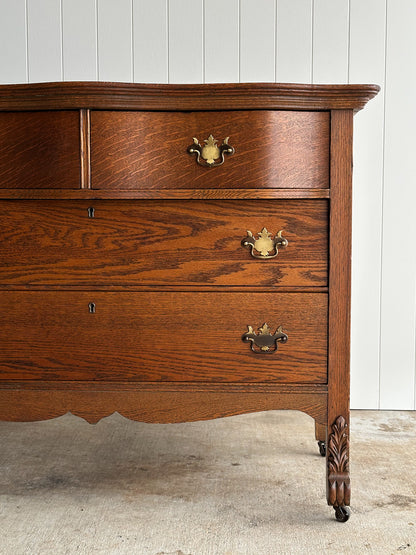 Antique Oak Serpentine Chest with Original Casters and Brass Hardware