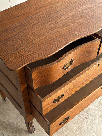 Antique Oak Serpentine Chest with Original Casters and Brass Hardware