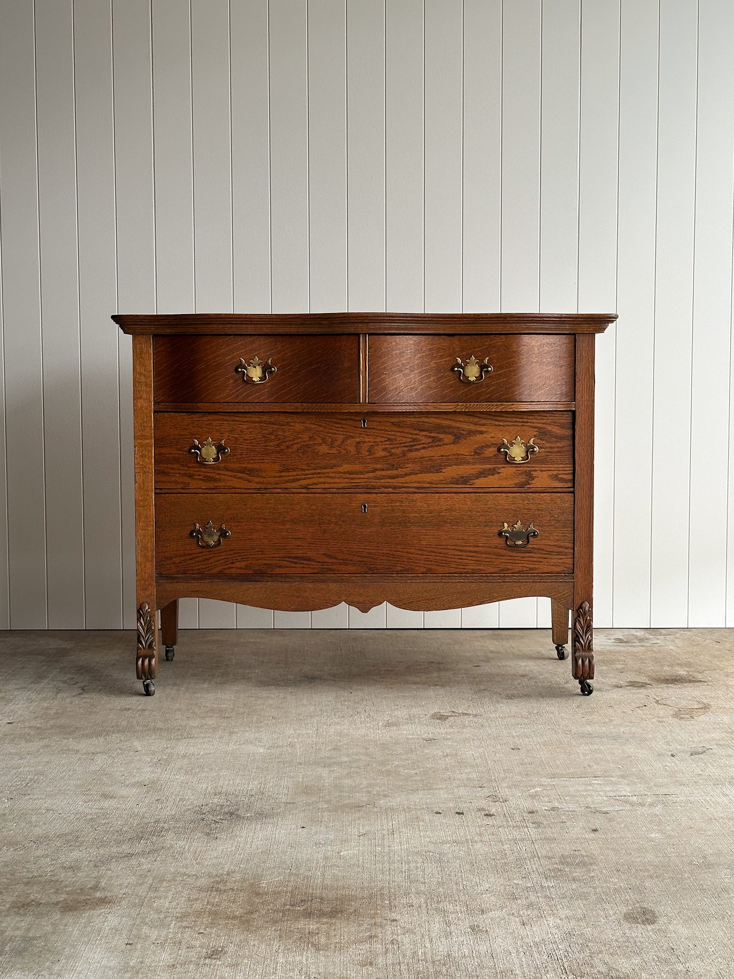 Antique Oak Serpentine Chest with Original Casters and Brass Hardware