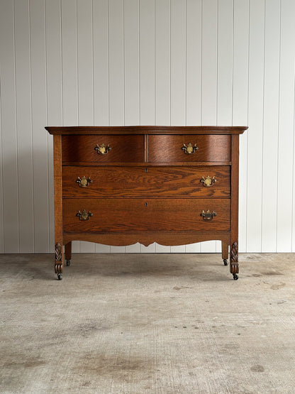 Antique Oak Serpentine Chest with Original Casters and Brass Hardware