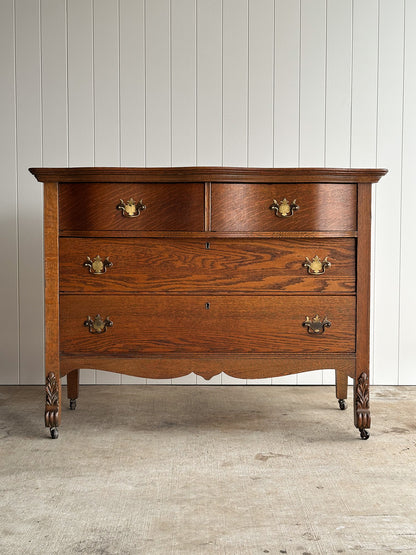 Antique Oak Serpentine Chest with Original Casters and Brass Hardware