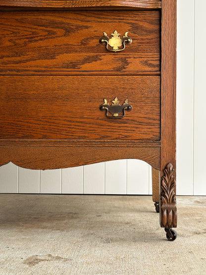Antique Oak Serpentine Chest with Original Casters and Brass Hardware