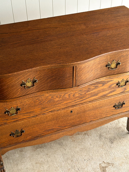 Antique Oak Serpentine Chest with Original Casters and Brass Hardware