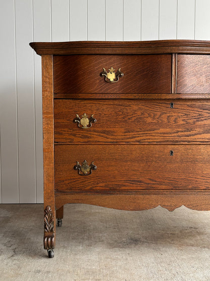 Antique Oak Serpentine Chest with Original Casters and Brass Hardware