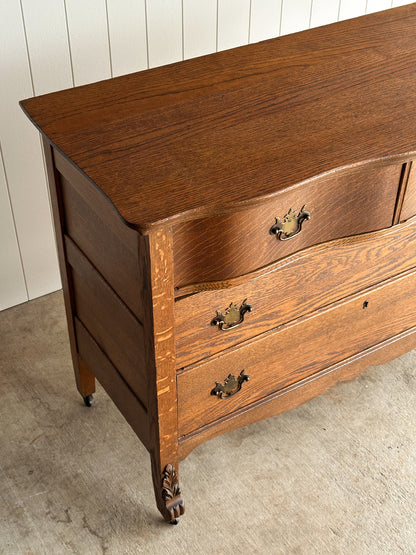 Antique Oak Serpentine Chest with Original Casters and Brass Hardware