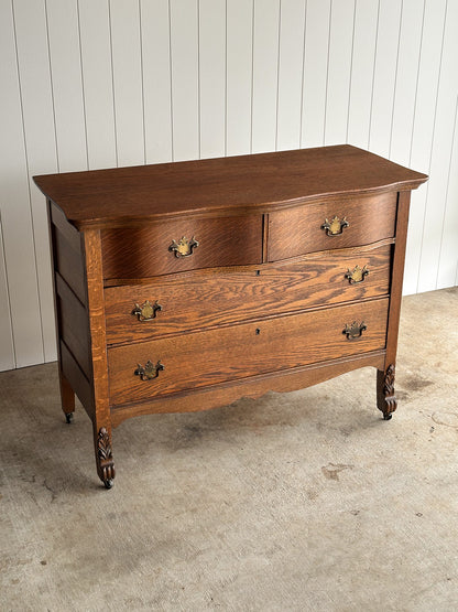 Antique Oak Serpentine Chest with Original Casters and Brass Hardware