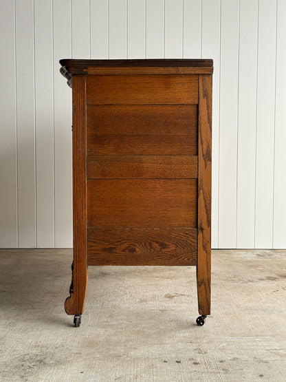 Antique Oak Serpentine Chest with Original Casters and Brass Hardware