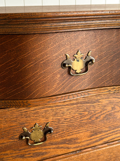 Antique Oak Serpentine Chest with Original Casters and Brass Hardware