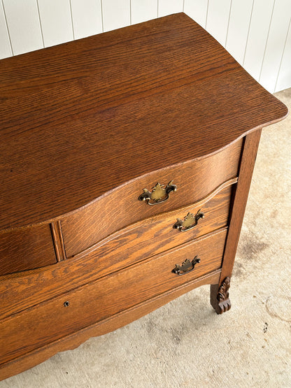Antique Oak Serpentine Chest with Original Casters and Brass Hardware